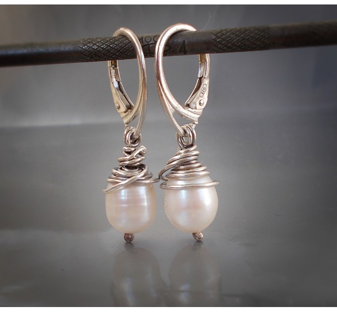 Sterling silver earrings with natural pearls