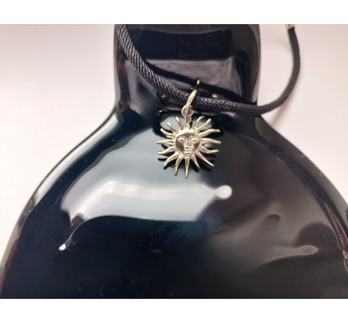 Sun choker with black leather cord. Handmade in silver orbrass