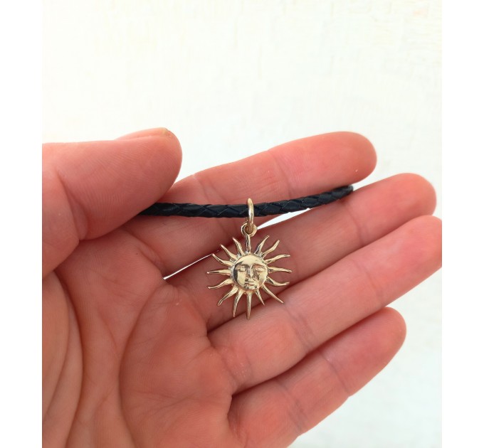 Sun choker with black leather cord. Handmade in silver or
brass