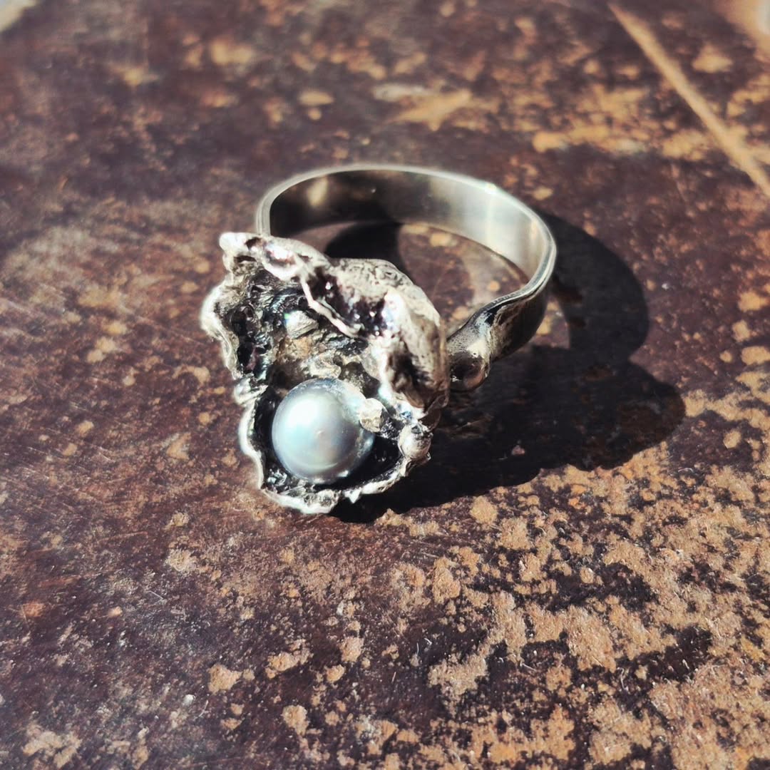 These one-of-a-kind handcrafted sterling silver designs were created using organic forms, molten textures, and natural p
